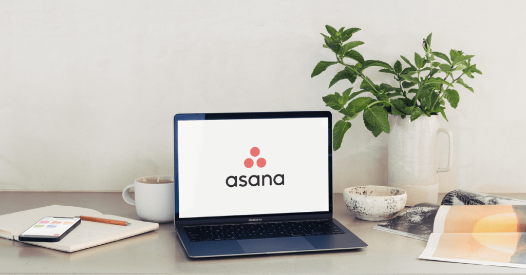 Image of a laptop displaying Asana logo